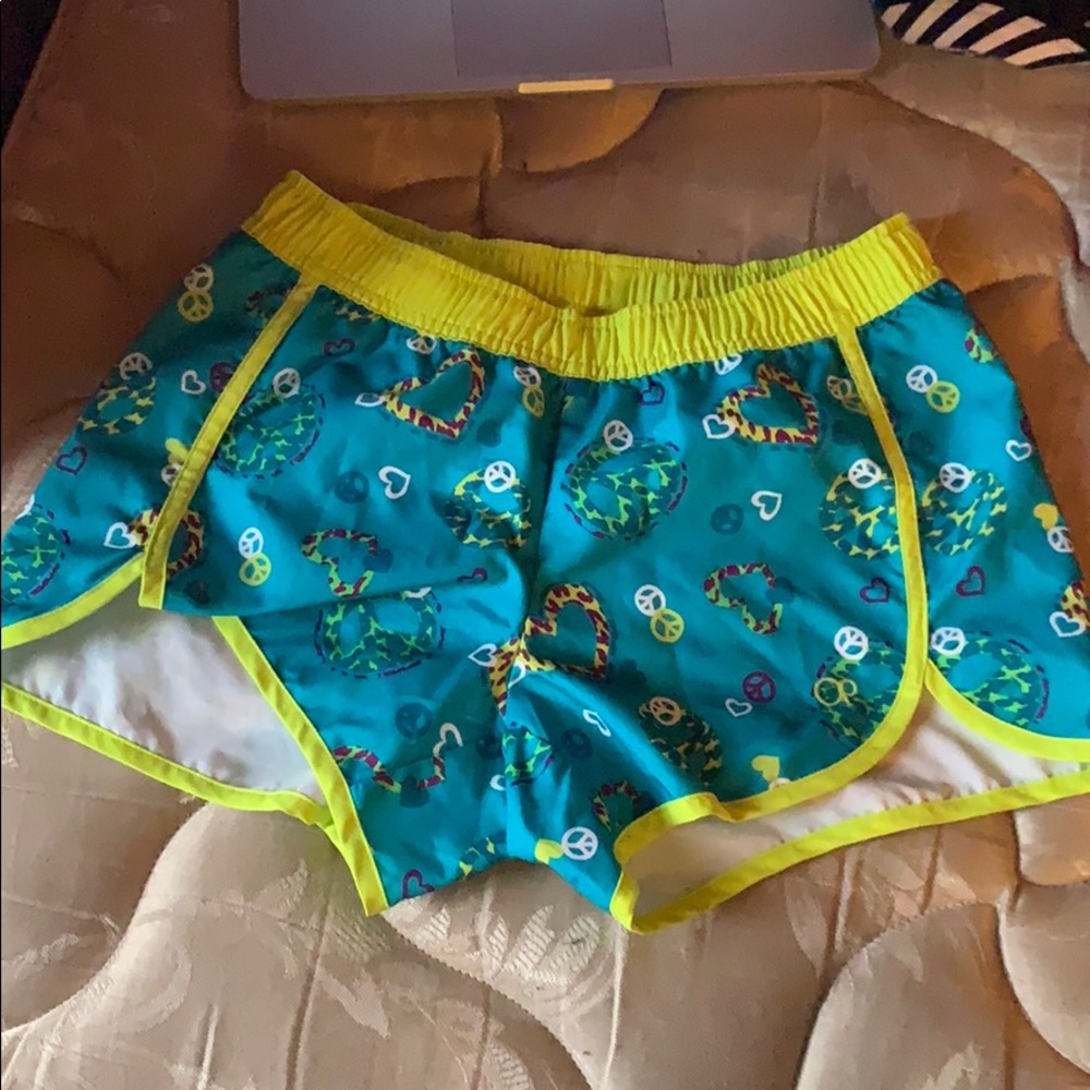 Blue shorts with piece signs